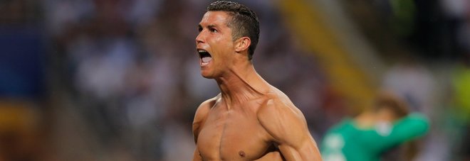 Real Madrid's Cristiano Ronaldo celebrates after scoring the winning penalty shootout during the Champions League final soccer match between Real Madrid and Atletico Madrid at the San Siro stadium in Milan, Italy, Saturday, May 28, 2016. Real Madrid won 5-4 on penalties after the match ended 1-1 after extra time.  (AP Photo/Manu Fernandez)